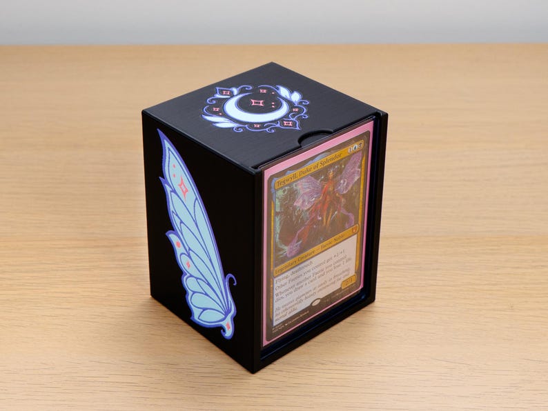 Black Faerie deck box with blue wings and a crescent moon